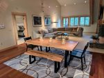 Large wood dining table with two benches and two chairs
